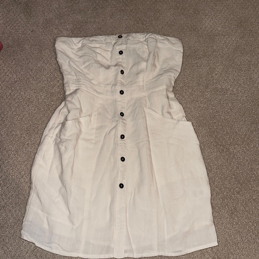 White strapless line dress, decorative buttons, zips up in the back